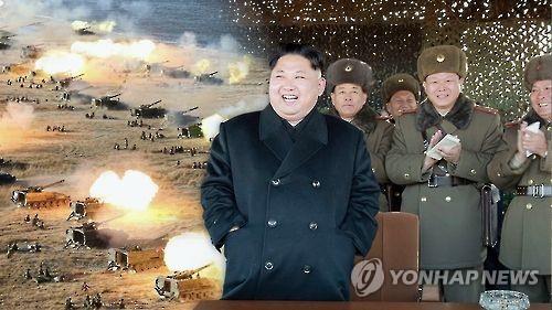 This undated captured image from Yonhap News TV shows North Korean leader Kim Jong-un and military officials overseeing a recent artillary drill on the North's frontline islands