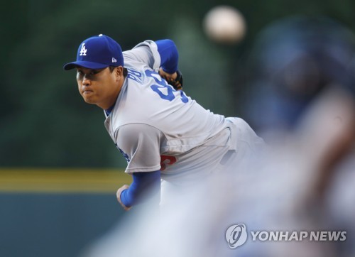 In this Associated Press photo, Ryu Hyun-jin of the Los Angeles Dodgers throws a pitch against the Colorado Rockies at Coors Field in Denver, Colorado, on May 11, 2017. (Yonhap)