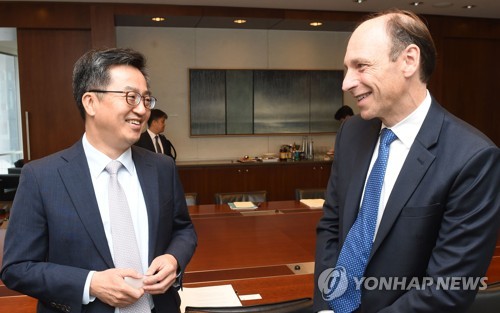 Ministry of Strategy and Finance South Korea's Finance Minister Kim Dong-yeon speaks with Richard Cantor chief risk officer of Moody's Corp. in New York on Sept. 19 2017