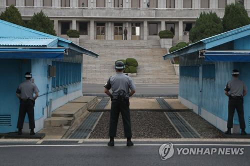 North Korean guards standing face-to-face at the Joint Security Area, a small strip of land in the truce village of Panmunjom