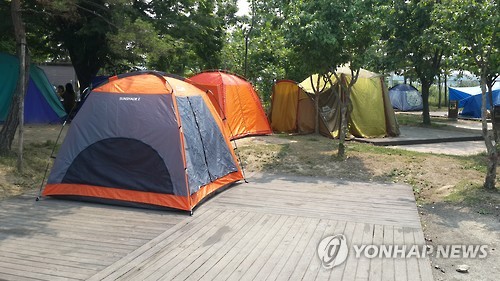 명당 알박기 유령 텐트족 극성 도심 캠핑장…결국 유료전환