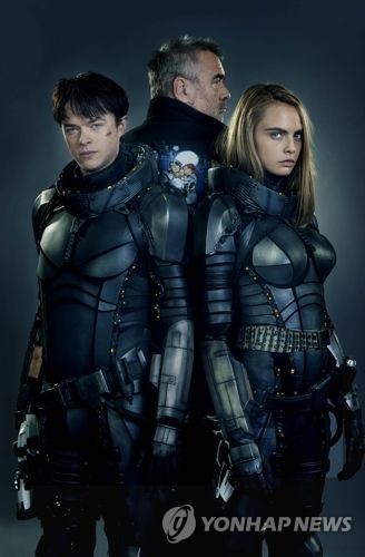 This promotional image provided by South Korea's Pan Cinema shows Director Luc Besson (center back), along with Dane DeHaan (L) and Cara Delevingne (R), the lead stars of "Valerian and the City of a Thousand Planets." (Yonhap)